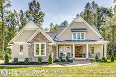 this is an image of a house in the country style with white trim and gray shingles