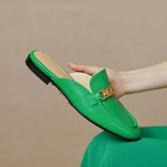 Handmade from premium leather. these loafer mules are really comfortable and breathable. Boasting chain decoration. these green mules help you show an easy chic look. Upper: Genuine Leather Lining: Genuine Leather Outsole: TPR Toe: Round Toe Closure: Slip on Color: White. Royal Blue. White is_handmade: Yes Elegant Green Slip-on Mules, Chic Green Slip-on Mules, Green Slip-on Mules, Green Leather Loafers For Summer, Chic Green Mules With Flat Heel, Chic Green Leather Mules, Chic Green Closed Toe Mules, Chic Green Loafers For Spring, Trendy Green Leather Mules