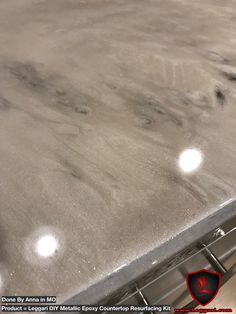 the top of a stainless steel oven with four round knobs on it's side