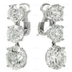 Magnificent Circa 1940s Old-European Cut Diamond Platinum Dangling Earrings | From a unique collection of vintage drop earrings at http://www.1stdibs.com/jewelry/earrings/drop-earrings/ Classic Clip-on Diamond Earrings, Three-stone Diamond Earrings For Wedding, Wedding Diamond Earrings With Three Stones, Classic Three Stone Diamond Earrings, Classic Three Stone Diamond Earrings For Formal Events, Formal Three Stone Diamond Earrings, Formal Diamond Three Stone Earrings, Three Stone Diamond Earrings In Fine Jewelry Style, Fine Jewelry Three Stone Diamond Earrings