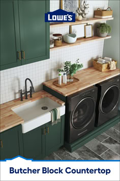 an image of a kitchen setting with green cabinets and washer and dryer combo