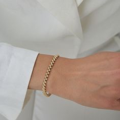 Indulge in the timeless allure of our 14k Gold Oval Box Links Minimalist Fine Jewelry Dainty Bracelet. Crafted with elegance and sophistication in mind, this exquisite piece features a sleek rectangular design that effortlessly exudes modern charm. Handcrafted with meticulous attention to detail, each delicate link showcases the highest quality 14k gold, ensuring both durability and luxury. Its minimalist aesthetic makes it the perfect accessory for any occasion, whether you're dressing up for a Elegant Tarnish Resistant Diamond Bracelet, Tarnish-resistant Tennis Bracelet For Weddings, Elegant Stackable Chain Bracelet For Formal Occasions, Dainty 14k Gold Chain Bracelet, Minimalist Tennis Bracelet With Adjustable Chain For Everyday, Elegant Formal Stackable Chain Bracelet, Modern Stackable Tennis Bracelet For Everyday, Delicate Gold Jubilee Tennis Bracelet, Elegant Tarnish-resistant Tennis Bracelet For Weddings