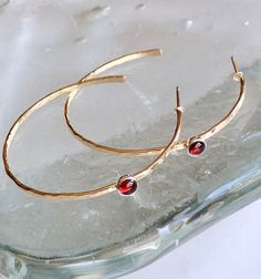 Hammered garnet hoops Gold Garnet Jewelry With Bezel Setting, Classic Hoop Earrings With Bezel Setting, Hoop Jewelry With Bezel Setting For Gift, Classic Bezel Set Hoop Earrings As Gift, Classic Bezel Set Hoop Earrings, Classic Bezel-set Hoop Earrings, 14k Gold Hoop Earrings With Bezel Setting, Garnet Birthstone Jewelry In Round Shape, Round Garnet Birthstone Jewelry