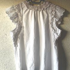 Cute White Eyelet-Trim Sleeveless Ruffled Top By Charter Club. New, Never Worn, Sze L . Pet And Smoke Free Home. Eyelet Trim Gives This Top From Charter Club An Upstyled Finish That Lets You Dress It Up Or Take It Out To Play. Slightly Fitted; Approx. 24" Long Designed To Fit And Flatter 5'4" And Under Frame Crewneck; Back Keyhole And Fastener Eyelet-Embroidered, Scalloped Trim At Armholes And High Neck Neckline Created For Macy's Cotton/Spandex Machine Washable Imported Sleeveless Summer Blouse With Ruffles, Sleeveless Ruffled Summer Blouse, Summer Sleeveless Blouse With Lace Trim, Sleeveless Blouse With Lace Trim For Day Out, Summer Tops With Lace Trim And Ruffled Collar, White Ruffled Tank Blouse, Summer Lace Top Blouse With Ruffled Collar, Summer Blouse With Lace Top And Ruffled Collar, Sleeveless Lace Trim Summer Blouse