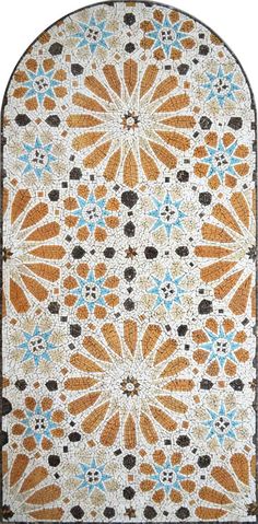 an orange, blue and white rug with designs on the floor in different shapes and sizes