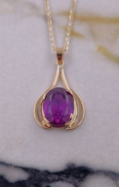 Crafted in 14ct Yellow Gold  Set with Created Alexandrite  Pendant is Vintage  Chain recently added  Hallmarked at the Edinburgh Assay Office  Really Good Condition Gold Teardrop Gemstones For Formal Events, Gold Teardrop Gemstones For Formal Occasions, Formal Gold Teardrop Gemstones, Gold Amethyst Jewelry With Diamond Cut, Elegant Gold Oval Pendant Gemstones, Gold Amethyst Jewelry With Polished Finish, Yellow Gold Pear-shaped Amethyst Jewelry, Gold Faceted Gemstone Pendant, Pear-shaped Amethyst Jewelry In Yellow Gold