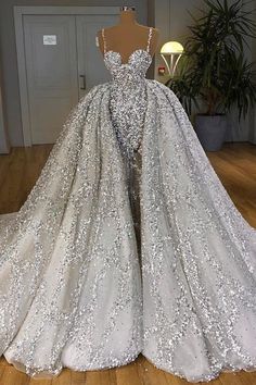 a wedding dress on display in a room