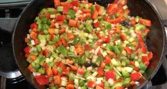 vegetables are being cooked in a skillet on the stove top, ready to be eaten