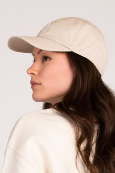 Fitted baseball cap with a 5-panel construction. Fully adjustable for your comfort with buckle detail on the back. Sun's out? No problem, this cap has a curved visor to keep you shaded. Sustainably made from the highest quality Organic Cotton; it is made to last. Re-wear your This Is Anyo accessory for years to come.  Comfort meets style featuring the recognizable This Is Anyo leaf embroidery in a tonal White stitch on the centre front.  Fabric Composition: 100% Organic Cotton. Certification: Or Fitted Baseball Caps, Fitted Joggers, Embroidered Baseball, Embroidered Baseball Caps, White Leaf, Fits Inspo, Sand Beige, Etsy Fashion, Independent Designers Fashion