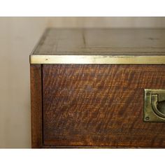 a close up of a drawer with a handle on the bottom and an opening in the middle