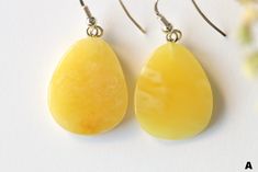 The earrings of Baltic amber in yellow color will not betray your expectations. It is one of the most popular colors of Baltic amber. Executed in the shape of a drop, they will perfectly match to any outfit. It is a genuine, natural and unique piece of jewellery created by nature, so you will feel special on every occasion. Delight yourself or your loved one with a little miracle from nature.  EARRINGS A Earrings length with clasp: 4 cm. / 1.57 in Weight: 3.5 g. / 0.12 oz Color: yellow Natural B Elegant Yellow Baltic Amber Necklaces, Elegant Yellow Baltic Amber Jewelry, Formal Baltic Amber Earrings, Yellow Baltic Amber Earrings, Silver Baltic Amber Earrings, Popular Colors, Amber Earrings, Baltic Amber, Feeling Special