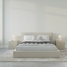 a large bed sitting on top of a white rug