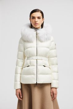 Find MONCLER COLLECTION Boed Short Down Jacket on Editorialist. The Boed down jacket delivers a sophisticated winter look, showcasing a feminine silhouette accentuated by a belted waistline. Crafted from longue saison, the hooded puffer jacket is finished with a luxurious long-haired sheep-skin trim. Luxury Down Outerwear With Padded Collar, Winter White Down Outerwear, Fitted Luxury Down Puffer Jacket, Luxury Fitted Down Puffer Jacket, Luxury Long Sleeve Winter White Outerwear, Luxury Down Puffer Jacket For Winter, Luxury Puffer Jacket With Padded Collar For Cold Weather, Luxury Down Long Sleeve Outerwear, Luxury Long Sleeve Down Outerwear