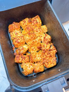 some food is cooking in a pan on the stove top and ready to be cooked