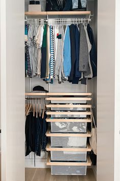 an organized closet with clothes and other items