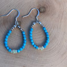 "These lovely earrings are made with sterling silver plated ear wires, gorgeous 3mm faceted turquoise beads, and stunning 3-4mm ethiopian welo opal rondelle beads! I love the combination of turquoise and opal! These earrings measure approximately 1.25\" in length from the ear wire down. Please view the photo of them next to a quarter for size reference.  I try my best to accurately depict every piece of jewelry I make, please look at each picture and feel free to ask me any questions All purchas Turquoise Teardrop Earrings With Faceted Beads, Turquoise Teardrop Faceted Beads Jewelry, Adjustable Turquoise Earrings With Faceted Beads, Turquoise Faceted Bead Earrings, Turquoise Earrings With Faceted Beads, Turquoise Czech Glass Earrings With Faceted Beads, Hypoallergenic Turquoise Beaded Earrings, Turquoise Sterling Silver Hypoallergenic Beaded Earrings, Hypoallergenic Turquoise Beaded Earrings In Sterling Silver