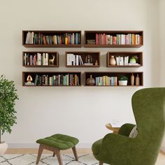 a green chair sitting in front of a book shelf filled with books