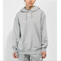 New With Tags Oversize Fit Grey/White Logo Nike White Fall Sweats, Nike White Hoodie For Loungewear, White Nike Hoodie For Loungewear, Nike Heather Grey Casual Sweatshirt, Nike Hoodies For Women, Essentials Sweatshirt, Hoodie Zumiez, Nike Essentials, Nike Cropped Hoodie