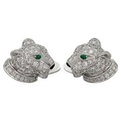 These gorgeous authentic Cartier cufflinks feature a panther head design crafted in 18k white gold and fully pave-set with round brilliant D-E-F VVS1-VVS2 diamonds, accented with green emerald eyes and black onyx noses. Made in France circa 2000s. Measurements: 0.47" (12mm) width, 0.51" (13mm) length. Excellent condition. Comes with original box. Cartier Silver Jewelry For Business, Cartier Cufflinks, Panther Head, Emerald Eyes, Cartier Panthere, Gold Cufflinks, Head Design, Pave Diamonds, Black Onyx