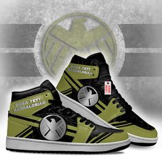 a pair of green and black high top sneakers with the logo of an emblem on them