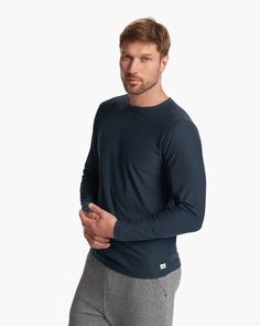 The Long Sleeve Strato Tech Tee is the softest piece of workout apparel on the planet, now doubling as your go-to long-sleeved must-have tee. With next-level comfort, our softest performance knit is moisture wicking with UPF 30+. | Vuori Long-Sleeve Strato Tech Tee | Navy Heather | Large Vuori makes premium performance apparel inspired by the active Coastal California lifestyle; an integration of fitness, surf, sport, and art. Breaking down the boundaries of traditional activewear, we are a new Hot Topic Shirts, Guess Shirt, Coastal California, Blue Long Sleeve Tops, California Lifestyle, Grey Long Sleeve Shirt, Mens Henley, Mens Joggers, Pullover Shirt