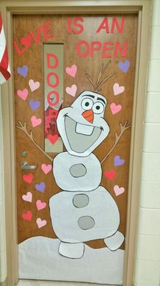 a door decorated with an image of a frozen snowman and the words love is an open door