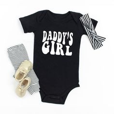 The perfect bodysuit for your perfect baby! These short sleeve bodysuits have 3 snap closure and double needle ribbed binding on neck, shoulders, sleeves, and leg openings. Machine wash cold, inside out. Air dry or tumble dry low. Black Cotton Short Sleeve Bodysuit For Summer, Fitted Short Sleeve Bodysuit With Letter Print For Summer, Summer Fitted Short Sleeve Bodysuit With Letter Print, Fitted Cotton Short Sleeve Bodysuit With Letter Print, Fitted Black Onesie For Summer, Fitted Cute Black Bodysuit, Cute Fitted Black Bodysuit, Cute Black Bodysuit For Playtime, Black Short Sleeve Onesie For Summer