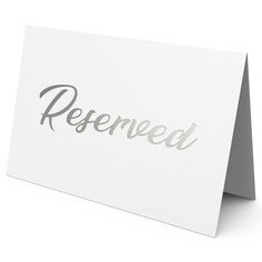 a white greeting card with the word reserved printed on it