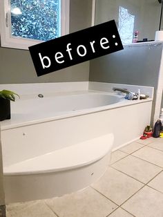 a bathroom with a white bath tub sitting next to a window in the middle of it