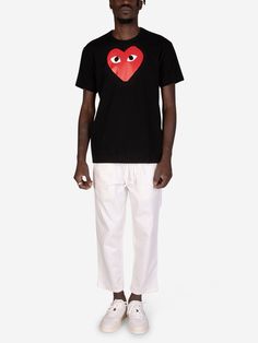 Discover the quintessential black t-shirt redefined. Crafted from premium cotton, this Comme des Garçons Play masterpiece boasts exceptional softness and breathability. Its classic ribbed collar and clean silhouette exude timeless style, effortlessly transitioning from casual days to elevated evenings. The pièce de résistance? The iconic, oversized red heart embroidered on the chest. A bold statement that captures the essence of Comme des Garçons Play's playful yet sophisticated aesthetic. Pair Cotton Heart Print T-shirt For Streetwear, Casual Heart Print T-shirt For Streetwear, Casual Black T-shirt With Heart Shape, Black Casual Heart-shaped T-shirt, Casual Black Heart-shaped T-shirt, Black Heart-shaped Casual T-shirt, Black Short Sleeve T-shirt With Heart Print, Cotton Streetwear Top With Heart Shape, Cotton Heart-shaped Top For Streetwear