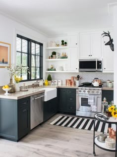 the kitchen is clean and ready to be used for cooking or baking, with stainless steel appliances