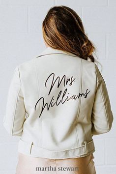 the back of a woman wearing a white jacket with mrs williams written on it