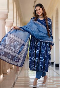 Grab this beautiful 3-piece set. The set comes with printed kurta has v neck, 3/4th sleeves & calf length teamed with printed trouser pants and a chanderi cotton dupatta to match. Color - Blue Kurta Fabric-Viscose Pant Fabric-Viscose Dupatta Fabric- Chanderi Cotton Neck-V Neck Sleeves-3/4th Sleeves Work - Print Detailing Washing Instructions-Dry Clean Model Height - 5.5 wearing size small. DISCLAIMER - The color of the product may be differ due to screen settings of device. A misprint here and a colour drop slip there is the beauty of printing which is not treated as a defect. Indigo Sets With Dupatta For Navratri, Indigo Navratri Set With Dupatta, Eid Cotton Anarkali Set With Printed Details, Cotton Anarkali Set For Eid With Printed Details, Bohemian Cotton V-neck Sets, Festive Indigo Cotton Dupatta, Indigo Long Sleeve Summer Sets, Blue V-neck Navratri Sets, Diwali Cotton Anarkali Set With Print