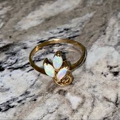 Make An Offer! This Stunning Ring Features Three Opals And A Swirl Design Set Into A 14kpg Gold Ring. Never Worn! I Believe It Is A Size 7, Will Send Measurements If Requested. *Box Shown For Display Only. This Will Not Include The Ring Box, But It Will Still Be Nicely Packaged. *Has Not Been Appraised. Ring, Jewelry, Opal, Fire Opal, Gem, Gold, 14k Gold, Promise, Gift, Birthday, Valentines, Christmas, Present, Holiday, 14kpg Yellow Gold Multi-stone Opal Ring, 14k Yellow Gold Multi-stone Opal Ring, Multi-stone Opal Ring In 14k Yellow Gold, Yellow Gold 14k Multi-stone Opal Ring, Opal Nose Ring, Jewelry Opal, Ring Ideas, Swirl Design, 14k Gold Ring