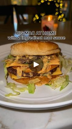 a white plate topped with a cheeseburger covered in lettuce