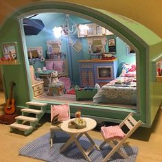 a doll house with furniture and accessories in it