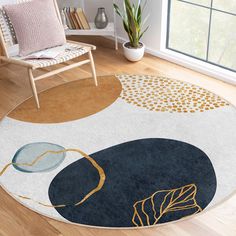 a round rug with an abstract design on the floor next to a chair and potted plant