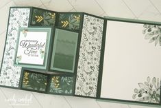 the inside of a handmade scrapbook with flowers and leaves on it's cover