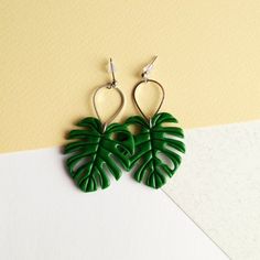 Monstera Leaf Earrings.The size of a leaf is about 1.4 inches (3,5 cm),Length of earrings is about 2.5 inches (5,5 cm).Materials: polymer clay, stainless steel earrings.Other earrings you can see here: https://www.etsy.com/shop/RinaStudioDesign?section_id=24005662• Submersion in water is not recommended for polymer clay as this will quickly deteriorate the product. It is recommended that you remove the earrings prior to swimming or showering to extend the life of the product.• Due to the handmad Handmade Leaf-shaped Earrings, Green Leaf-shaped Earrings For Pierced Ears, Green Leaf-shaped Earrings As A Gift, Green Leaf-shaped Earrings For Gift, Green Leaf-shaped Earrings, Trendy Leaf-shaped Earrings For Gifts, Green Leaf-shaped Jewelry With Matching Earrings, Trendy Green Leaf-shaped Jewelry, Leaf-shaped Earrings For Gift