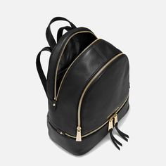 The ‘Rhea’ black leather backpack is an exquisite piece from MICHAEL Michael Kors. It's elegantly fashioned from grained leather and accentuated with delicate gold-tone hardware. Elegant Travel Backpack With Leather Lining, Elegant Leather Backpack With Zipper, Elegant Leather Backpack With Zipper Closure, Elegant Leather Travel Backpack With Zipper, Chic Leather Formal Backpack, Elegant Leather Backpack With Gold-tone Hardware, Classic Backpack With Gold-tone Hardware For Travel, Classic Travel Backpack With Gold-tone Hardware, Elegant Formal Backpack With Gold-tone Hardware