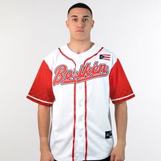 a man in a baseball uniform poses for the camera with his hands on his hips