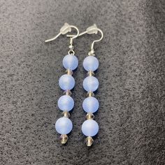 Material: Metallic Color: Small shiny pearl with blue pearl Type: Earrings Style: Casual Elegant Blue Drop Clip-on Earrings, Blue Crystal Drop Earrings For Formal Occasions, Blue Single Earring As Gift, Elegant Blue Round Bead Jewelry, Elegant Light Blue Beaded Dangle Earrings, Elegant Blue Crystal Earrings, Light Blue Beaded Dangle Earrings For Party, Blue Drop Clip-on Earrings For Gift, Blue Drop Clip-on Earrings For Formal Occasions