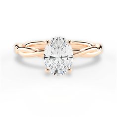 a rose gold ring with an oval cut diamond in the center and twisted band around it