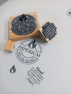 a rubber stamp with the words imperium and an image of a fire on it