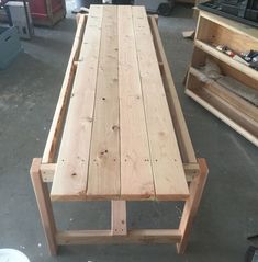 a table made out of wooden planks in a shop