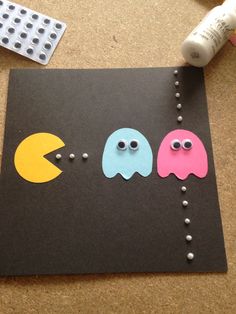 the craft is made to look like pacman and ghost faces with beads on them