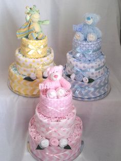 three tiered baby shower cakes with teddy bears on top