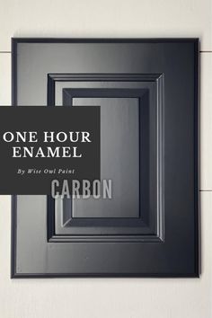 a black frame with the words one hour enamel on it and an image of carbon