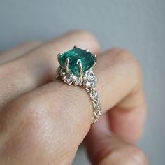 Luxury Emerald Birthstone Ring For Promise, Luxury Emerald Birthstone Promise Ring, Exquisite Emerald Cut Emerald Ring With Accent Stones, Exquisite Emerald Cut Ring With Accent Stones, Exquisite Emerald Cut Emerald Ring, Luxury Emerald Ring With Radiant Cut, Unique Emerald Ring For May Birthstone, Unique Emerald Cut Emerald Ring, Radiant Cut Emerald Ring Luxury