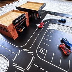 toy cars and trucks are parked on the road